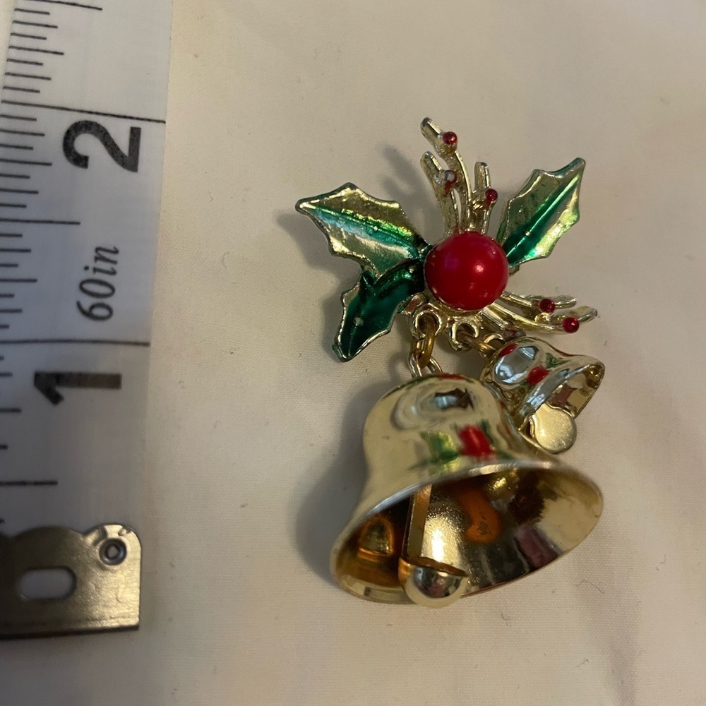 Vintage pin with gold bells that jingle and Holly